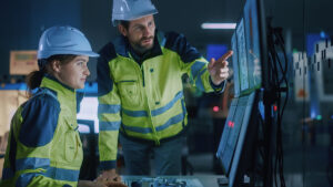 Engineers looking at computer screen